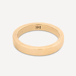 Solid gold everyday band ring with a polished finish on a white background.