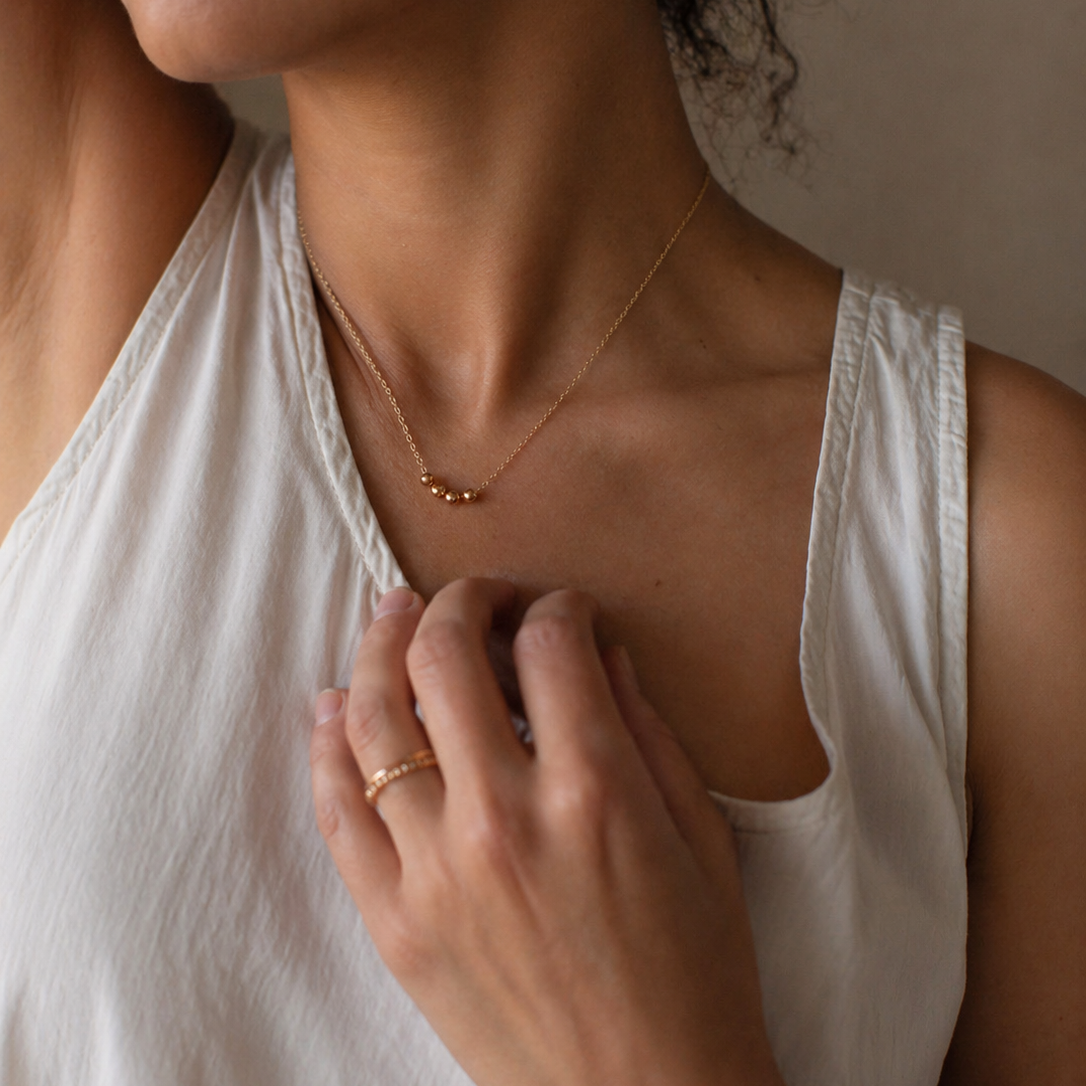 Sphere Necklace, Gold Fill worn on a model