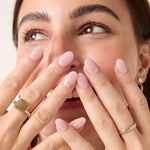 Woman wearing the brass square ring, styled with a casual and confident look.