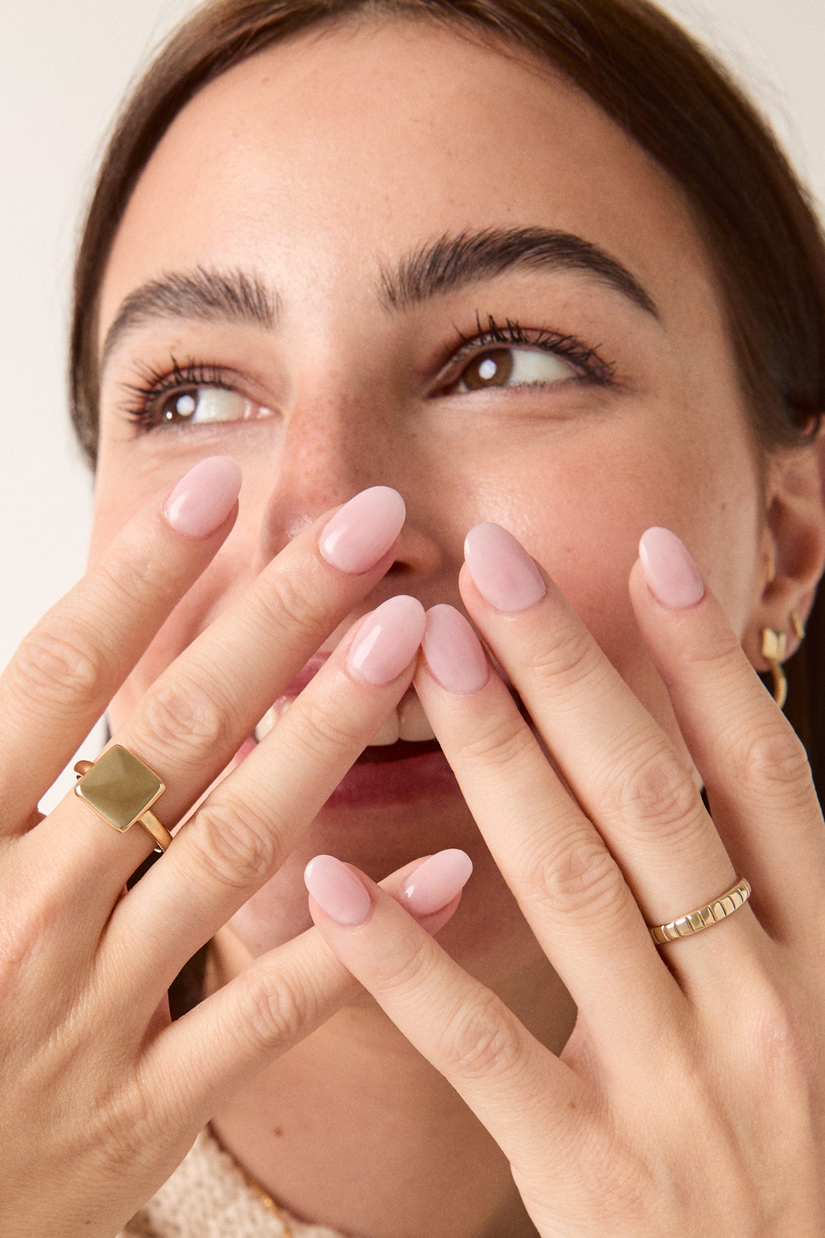 Woman wearing the brass square ring, styled with a casual and confident look.