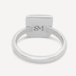 Close-up of the interior of the sterling silver square ring, featuring the stamped SM logo detail.