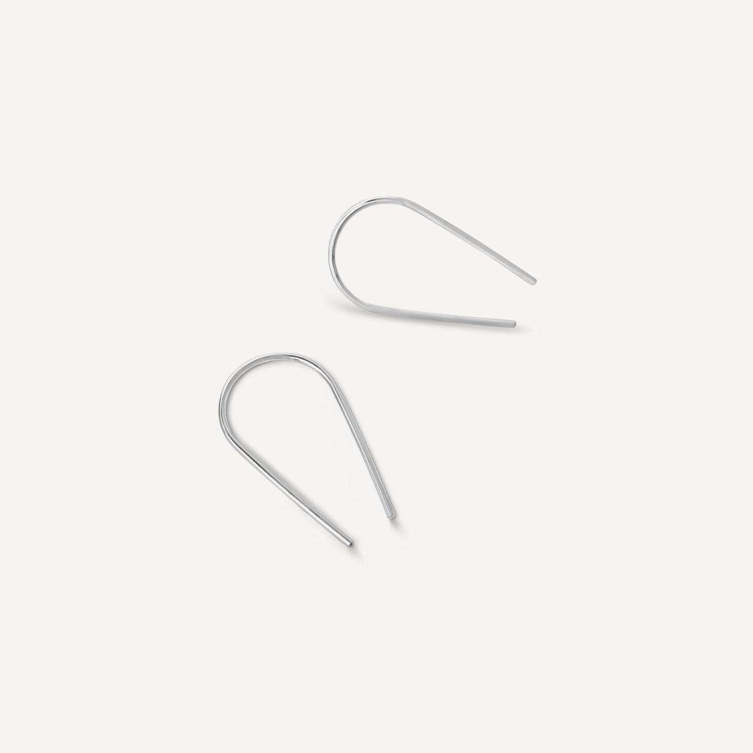 Close-up of Sterling Silver Palmer Arch Threader Earrings handcrafted in Denver, showcasing a minimalist and timeless design.