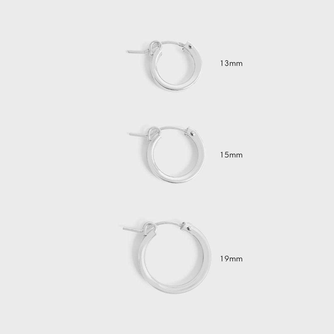 A side-by-side comparison of 13mm, 15mm, and 19mm gold-filled hoop earrings.