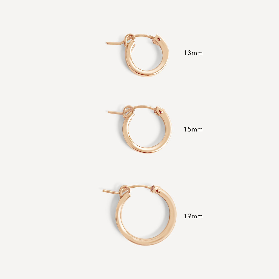 A side-by-side comparison of 13mm, 15mm, and 19mm gold-filled hoop earrings.