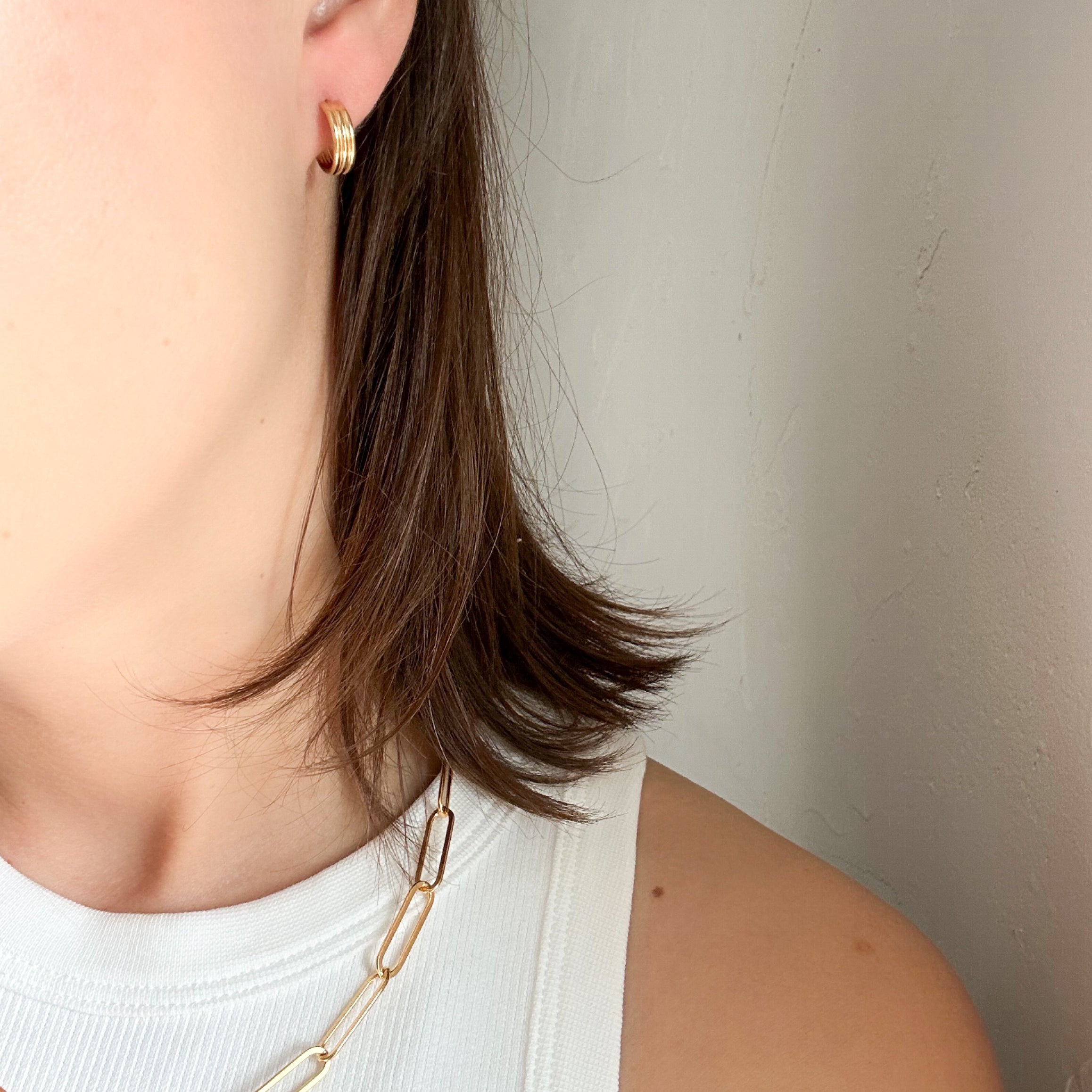 Woman wearing Triple Hoop Earrings in gold fill, a perfect accessory for day-to-night wear.