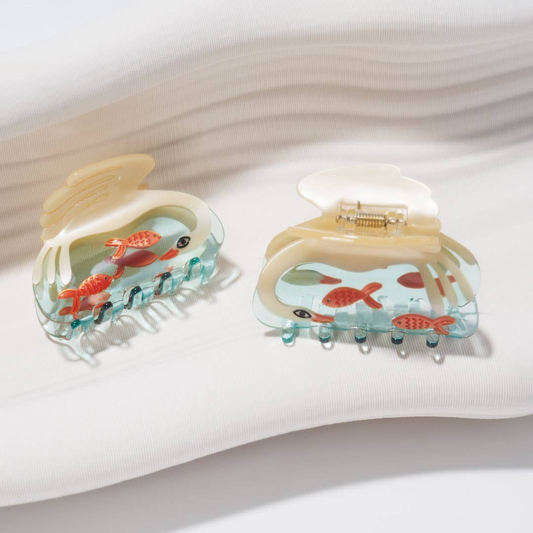 White Swan Hair Claw arranged with other clips