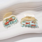 White Swan Hair Claw arranged with other clips