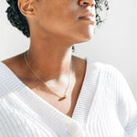 Nova Floating Sphere Necklace being worn, highlighting its elegant and versatile design.
