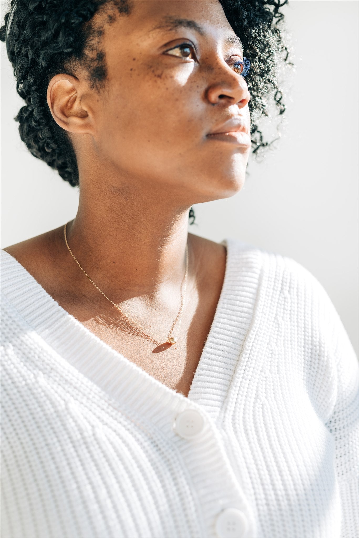 Nova Floating Sphere Necklace being worn, highlighting its elegant and versatile design.