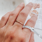 Close-up of Ring Sizer on hand measuring ring size.