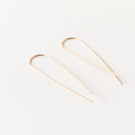 Gold fill long threader earrings with a sleek minimalist design, displayed on a white background.