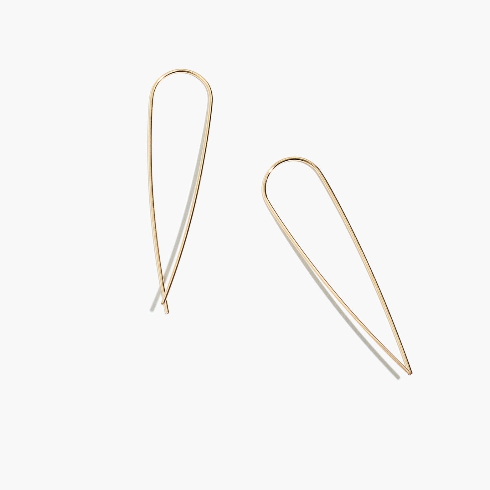 Close-up of gold fill long threader earrings highlighting the delicate and lightweight design.