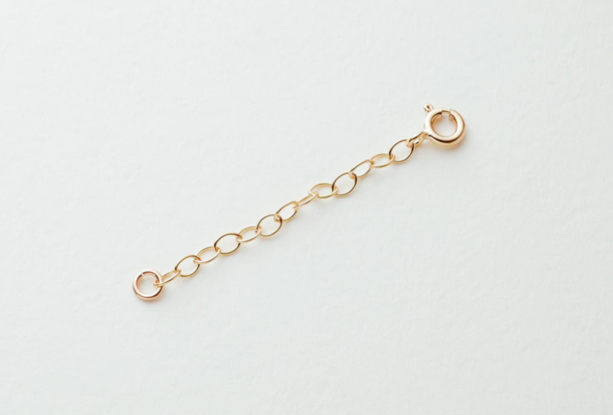 Gold-filled detachable chain extender with a spring clasp, perfect for customizing necklace lengths.