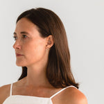 Close-up of model wearing Eloise Threader Earrings, showcasing their lightweight and versatile look.