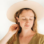 Gold fill hoops worn by model - timeless and versatile earrings.