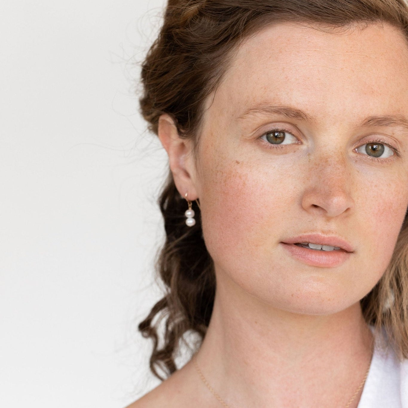 Model wearing the Grit Pearl Necklace, exuding a feeling of elegance and simplicity.