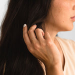 Close-up of the Hammered Ring in gold fill on a hand, highlighting its textured design.