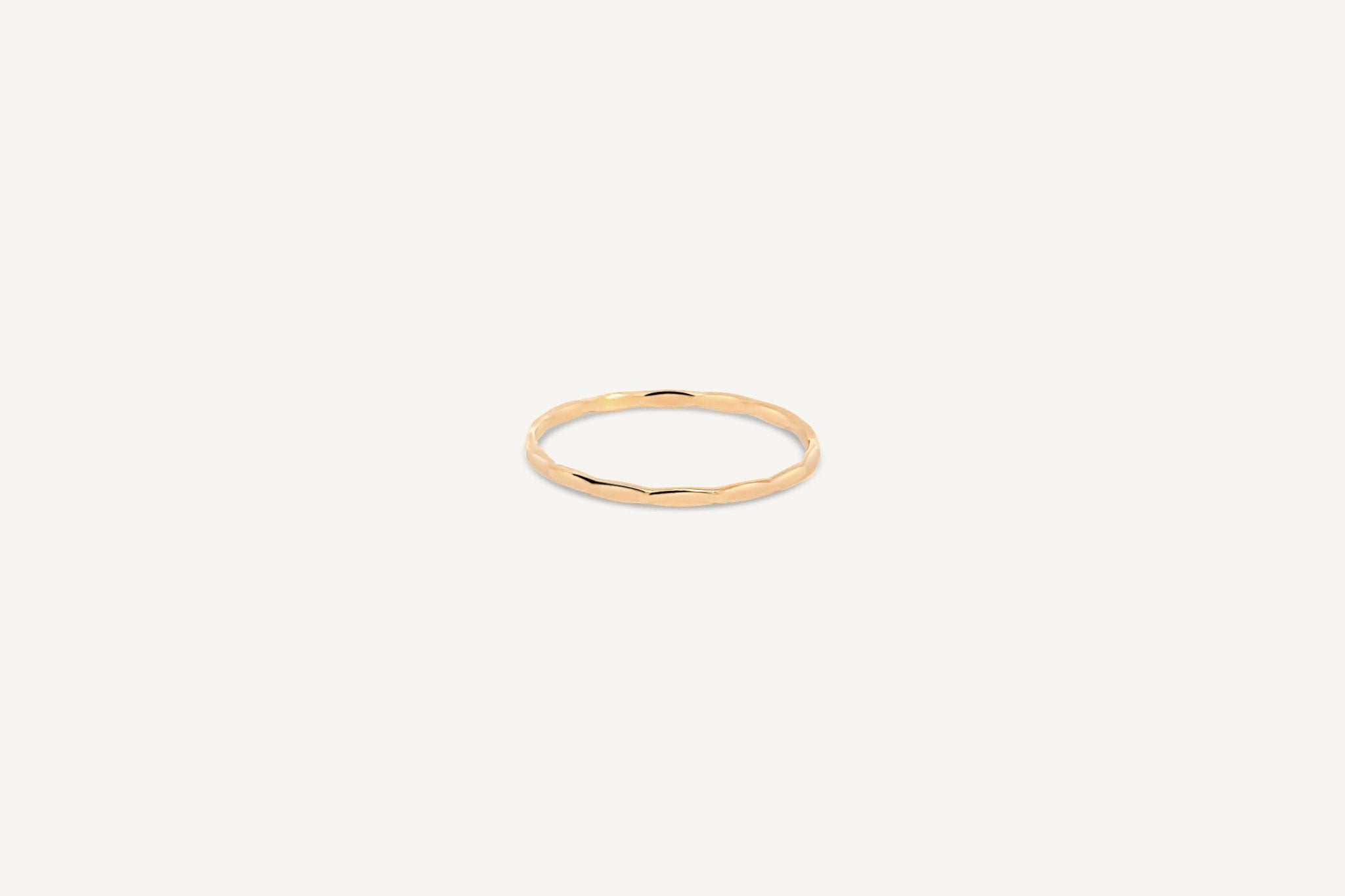 Hammered Ring in gold fill featuring a textured, minimalist design on a white background.