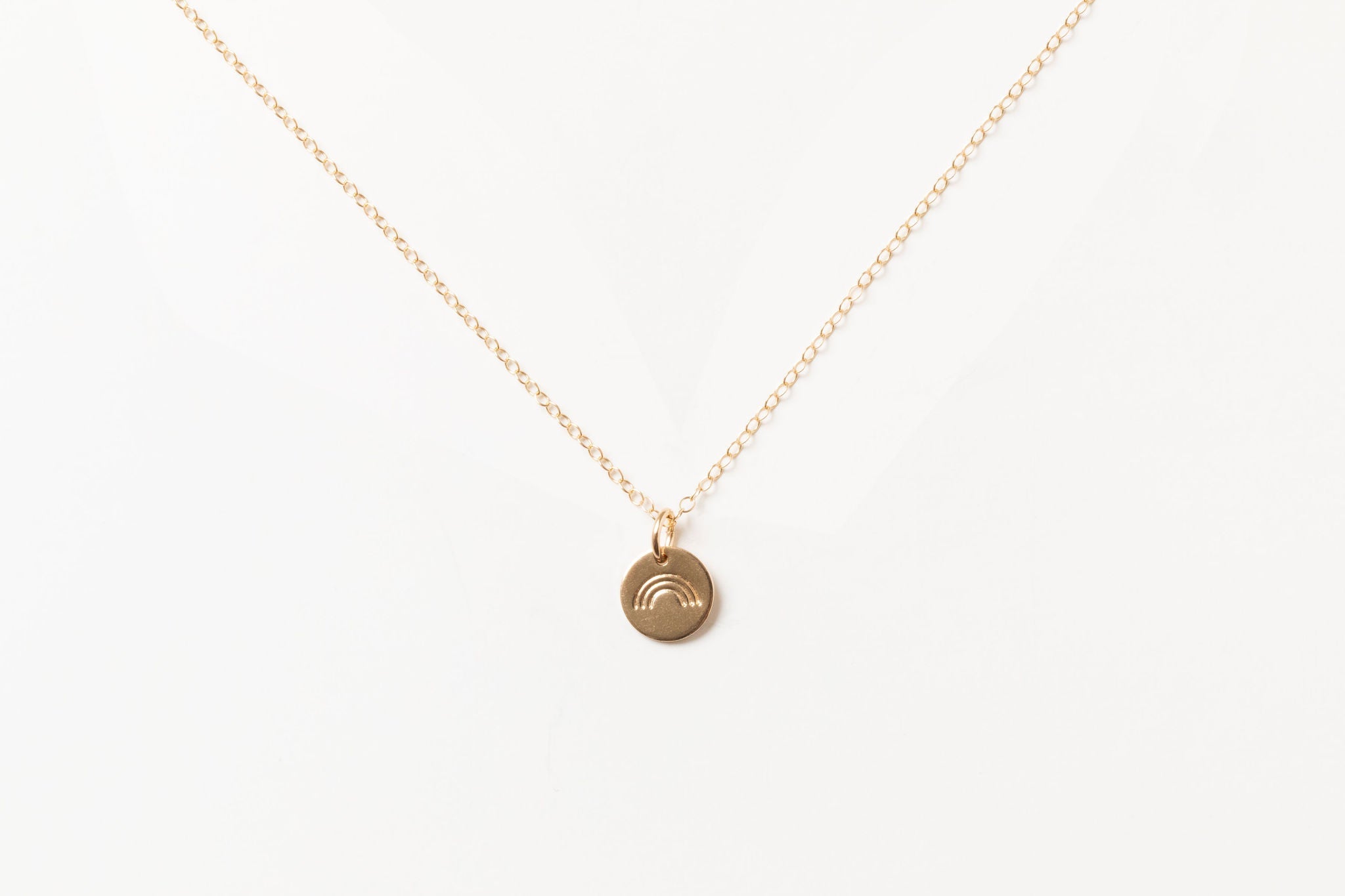 Hope Necklace in gold fill featuring a minimalist disc pendant, displayed on a white background.