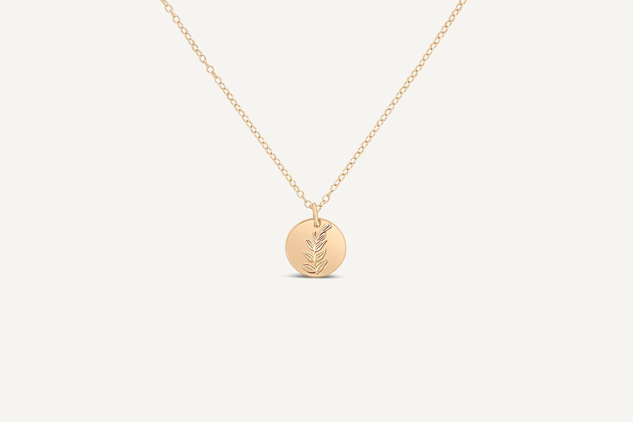 Close-up of the Hygge Bloom Necklace in gold fill on a model, showcasing its delicate and intentional design.