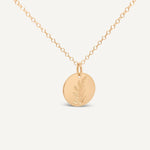 Hygge Bloom Necklace in gold fill featuring a delicate disc pendant, displayed on a white background.