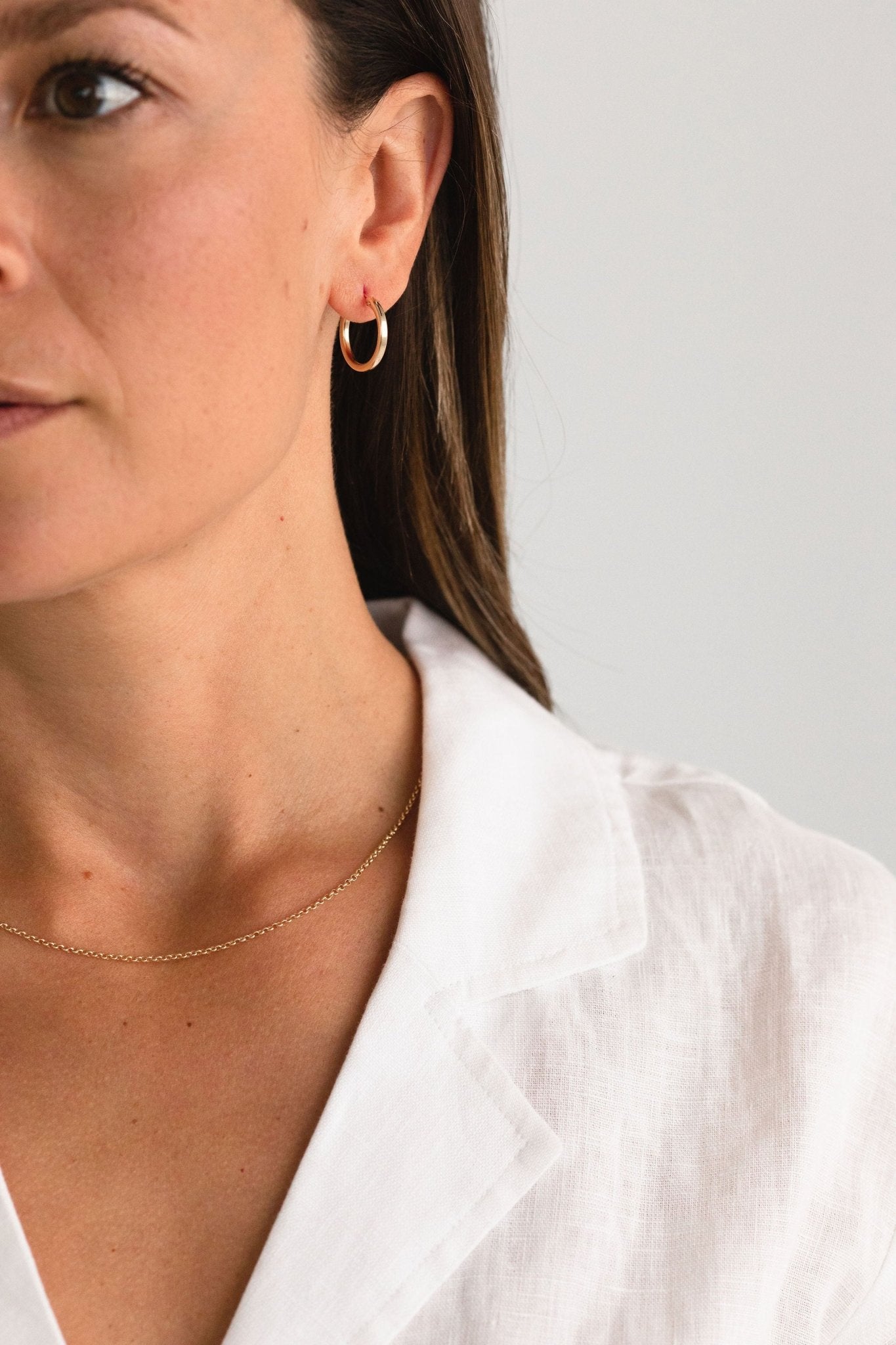 Minimal gold fill necklace layered with other pieces for a refined look.