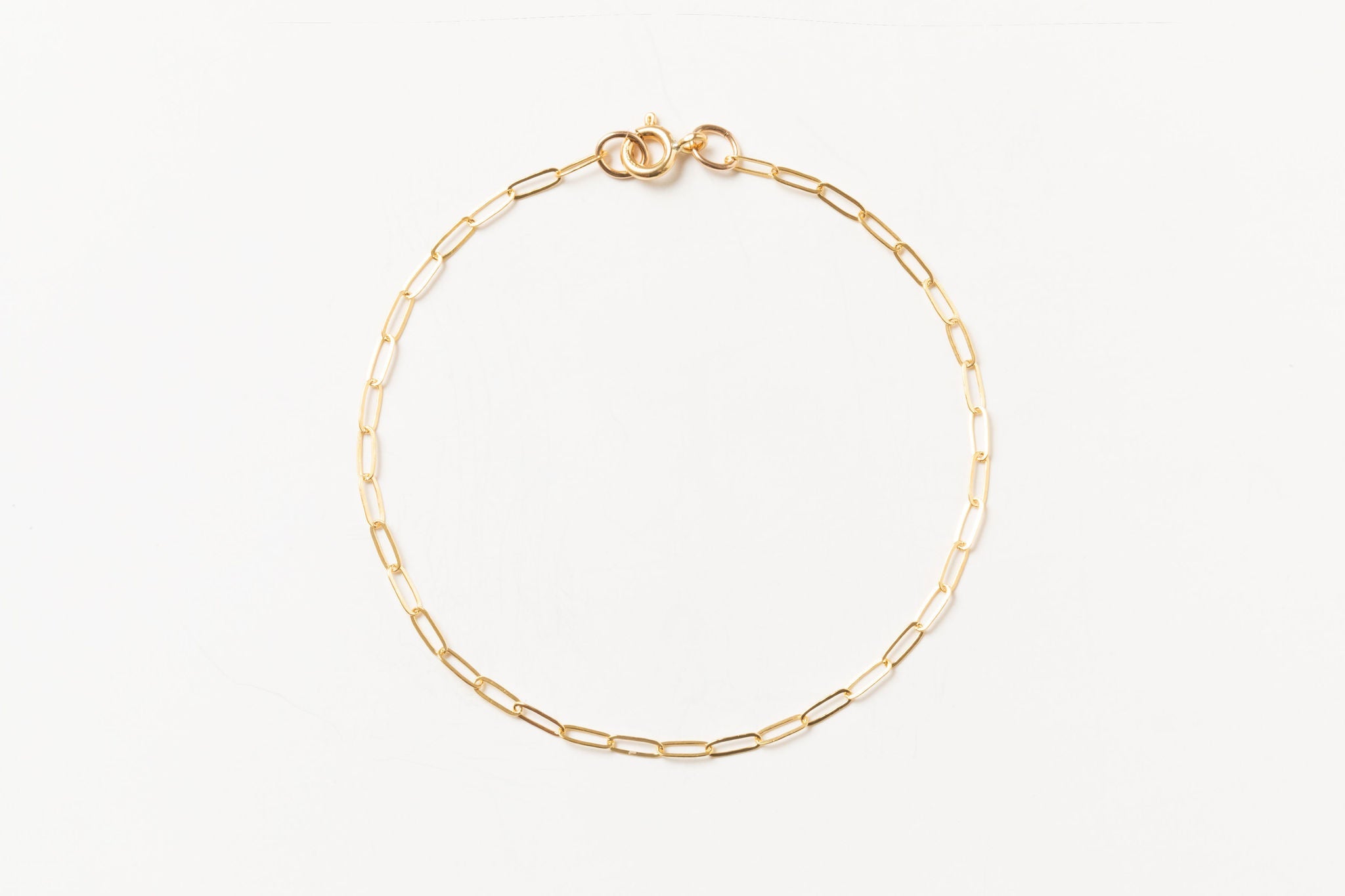 Livy Link Bracelet in gold fill, displayed on a white background, highlighting its bold and simple link chain design.