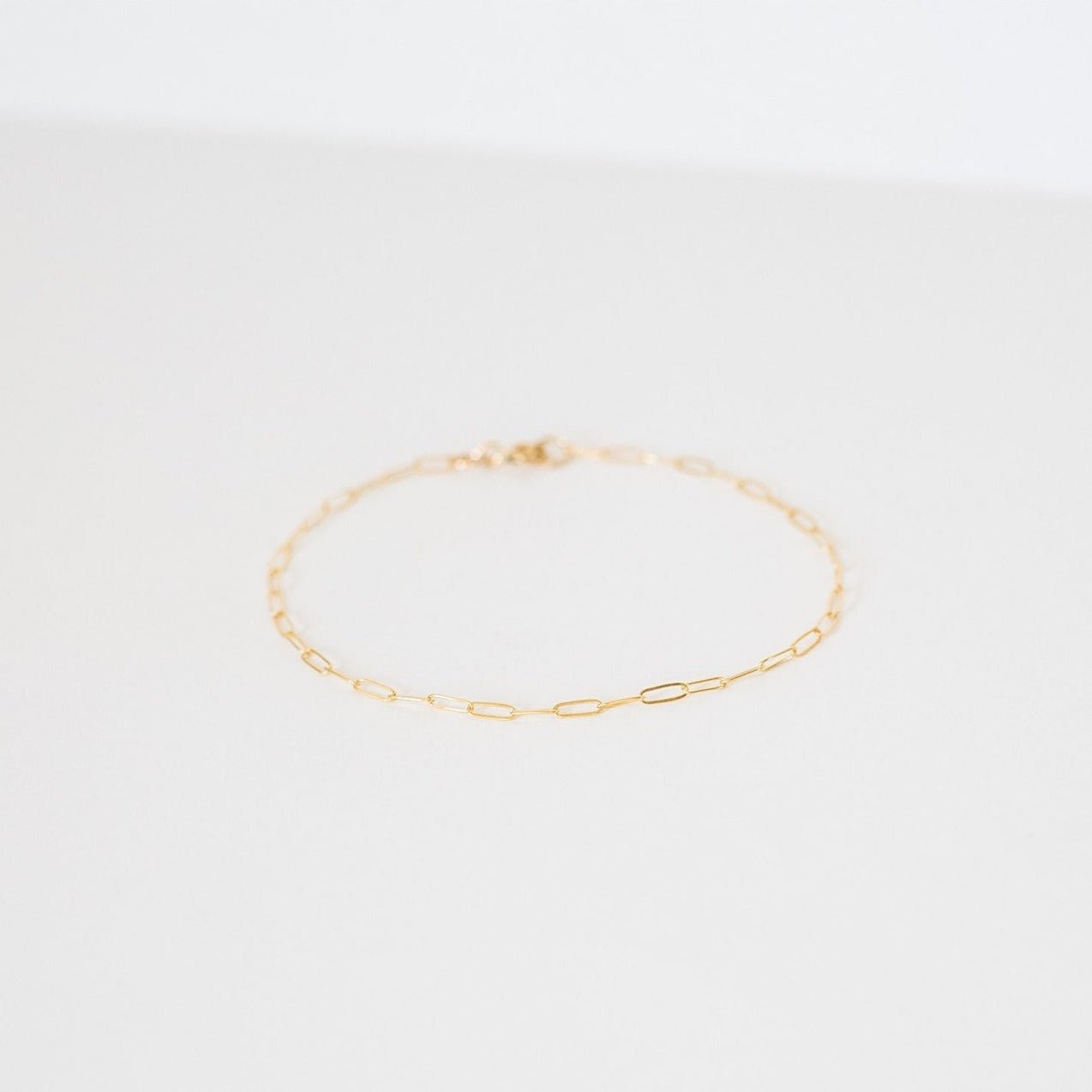 Close-up of the Livy Link Bracelet in gold fill, showcasing its retro-inspired link chain design.