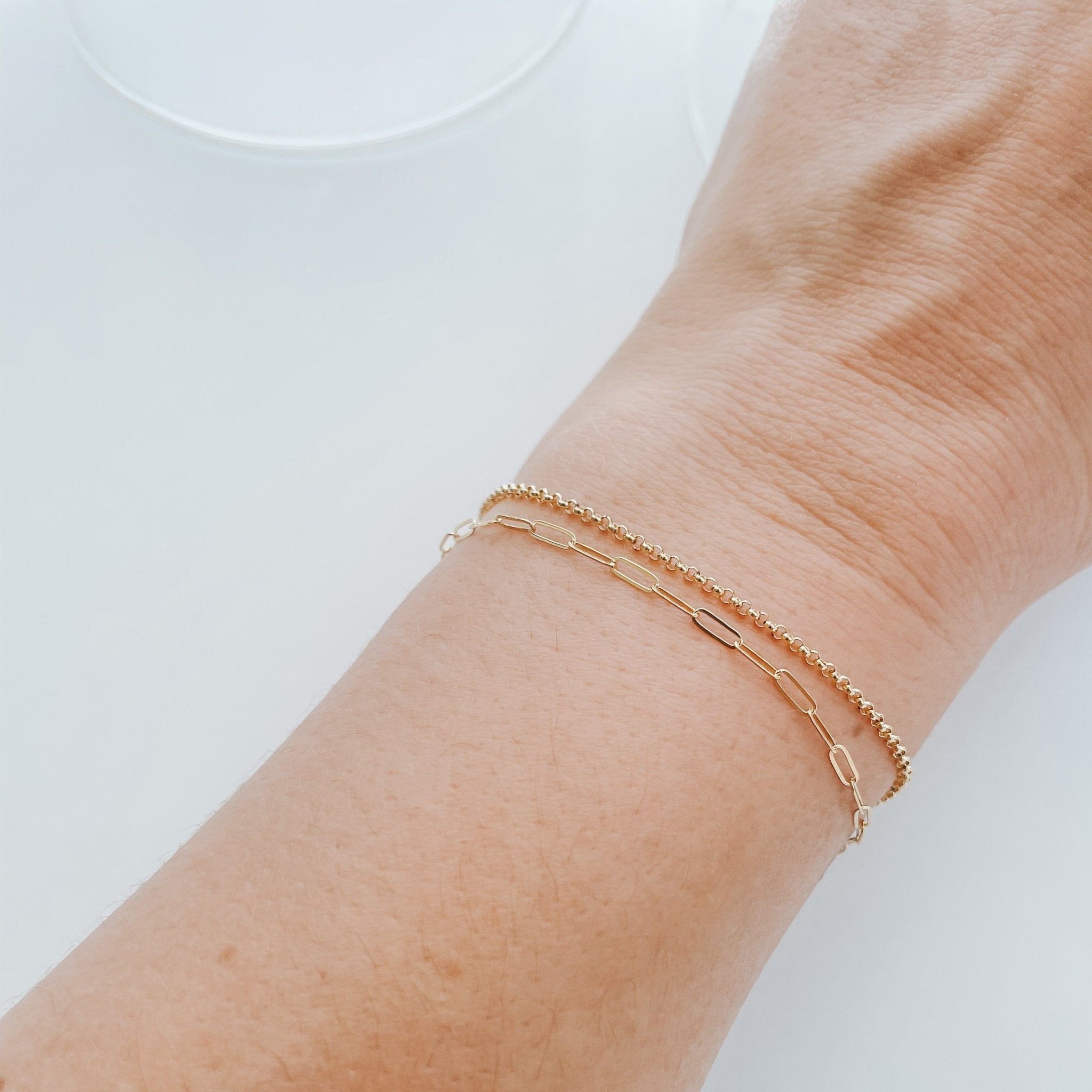 Model wearing the Livy Link Bracelet in gold fill, styled with an elegant yet casual outfit.