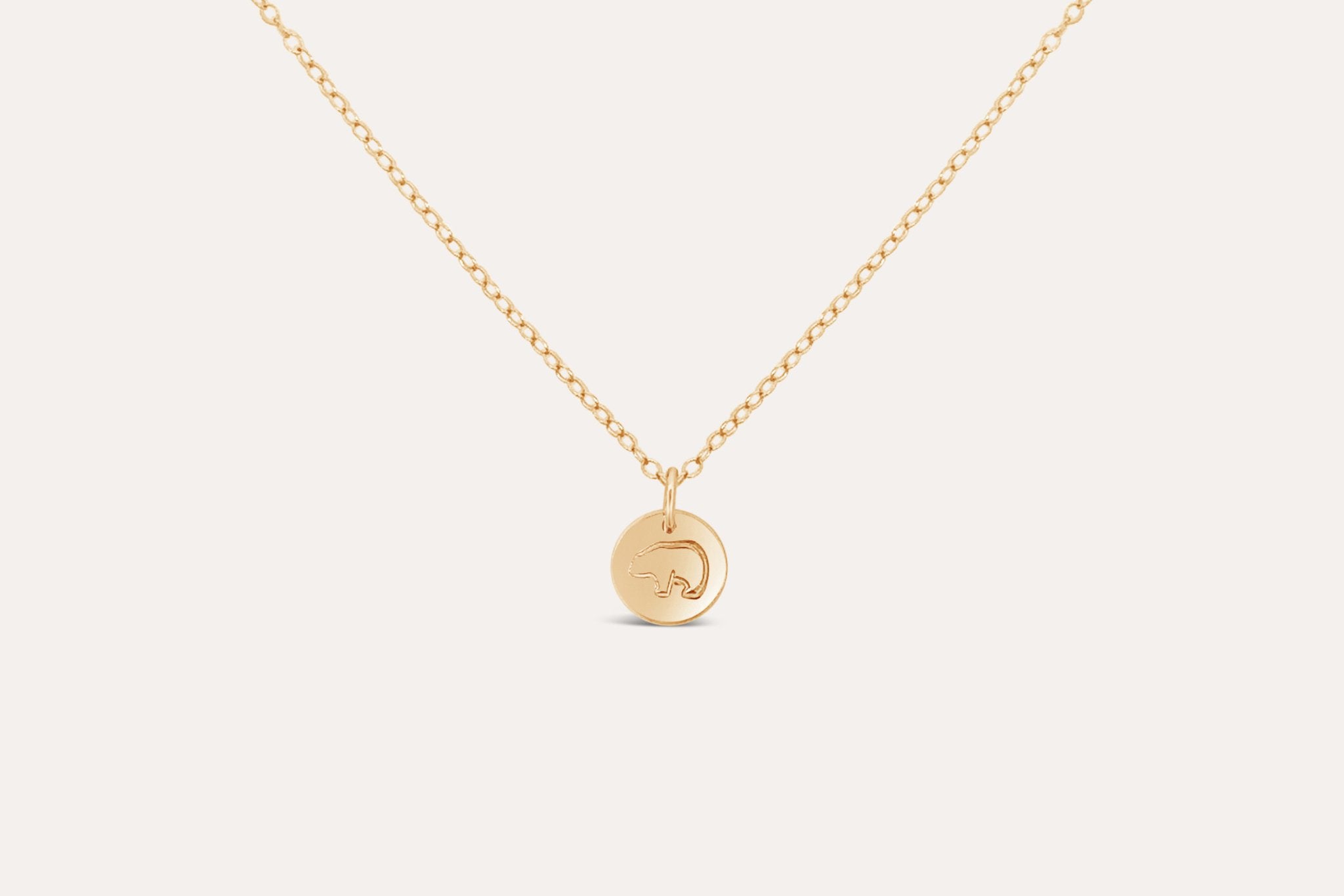 Close-up of Mama Bear and Baby Bear gold fill necklace, symbolic gift for mothers and daughters.