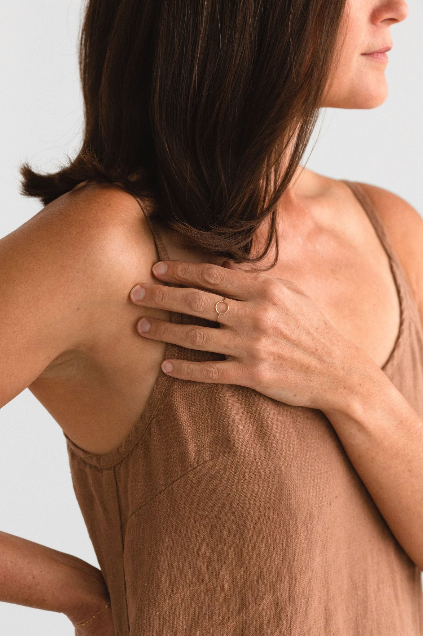 Woman wearing the Open Circle Ring, highlighting its delicate gold-filled design as a statement of intention.